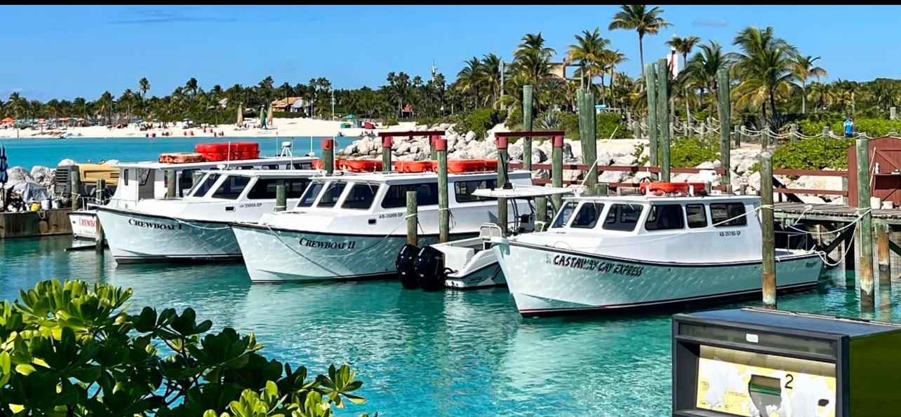 Disney Magic cruise ship with Evans-built crew boats at dock