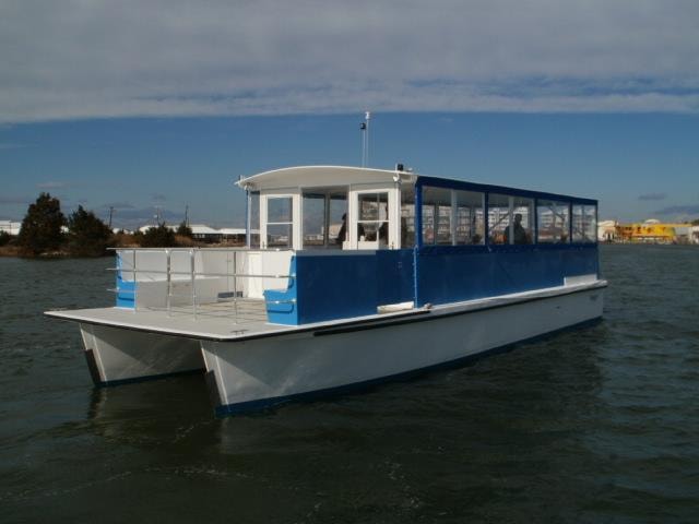 Custom Evans blue and white catamaran passenger vessel