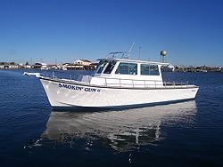 Smokin' Gun II — custom Evans boat moored at marina