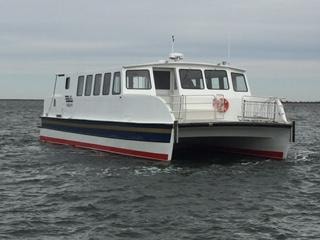 Custom Evans catamaran passenger ferry on open water