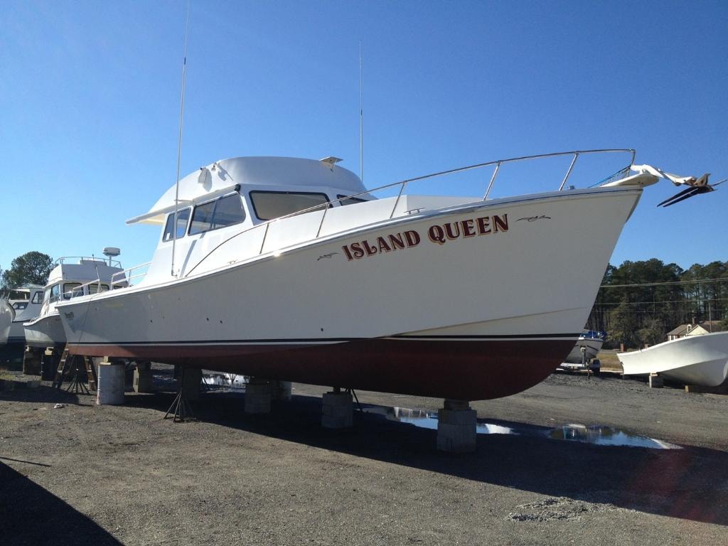 Island Queen — restored classic cruiser in the boatyard